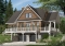 Version couleur no. 1 - Vue avant - Plan chalet en montagne ou bord de l'eau, 4 chambres, foyer double face, garage double, solarium  - Louisia 4